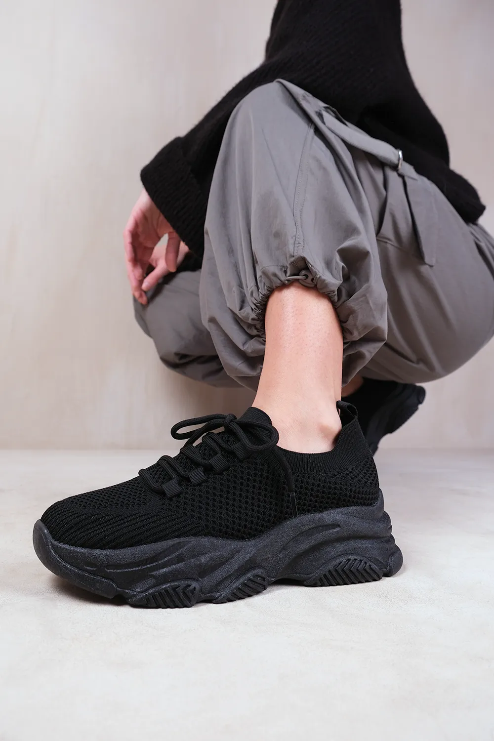 WHISPER CHUNKY SOLE KNIT TRAINERS WITH CRYSTAL EMBELLISHMENT IN BLACK